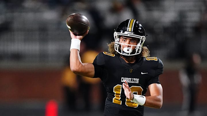 Oct 20, 2023; Carrollton, GA, USA; Carrollton Trojans quarterback Julian Lewis (10) passing against the Westlake Lions during the first half at Grisham Stadium. The 15-year-old Carrollton High student has already committed to playing for the University of Southern California Trojans and has been considered one of the top high school quarterback prospects. Mandatory Credit: John David Mercer-Imagn Images