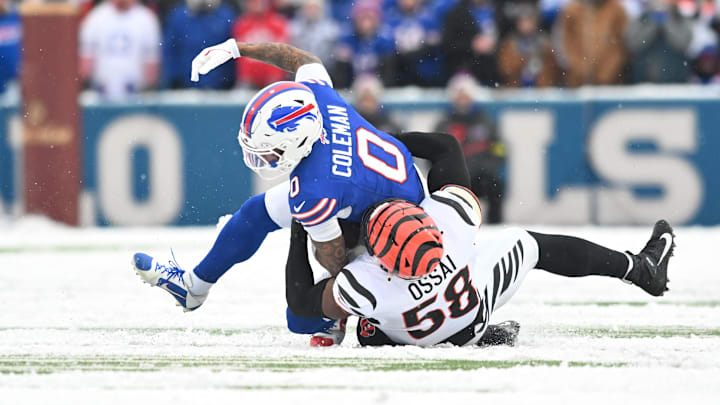 Dec 7, 2025; Orchard Park, New York, USA; Buffalo Bills wide receiver Keon Coleman (0) is brought down by Cincinnati Bengals defensive end Joseph Ossai (58)