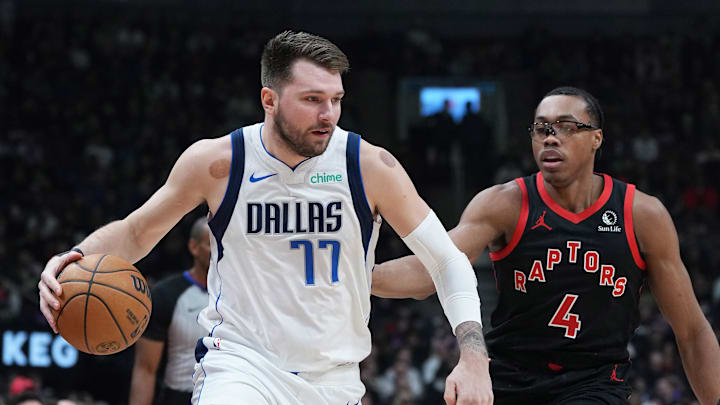 Dec 7, 2024; Toronto, Ontario, CAN; Dallas Mavericks guard Luka Doncic (77) drives to the basket against Toronto Raptors forward Scottie Barnes (4) during the first quarter at Scotiabank Arena. Mandatory Credit: Nick Turchiaro-Imagn Images Dec 7, 2024; Toronto, Ontario, CAN; Dallas Mavericks guard Luka Doncic (77) drives to the basket against Toronto Raptors forward Scottie Barnes (4) during the first quarter at Scotiabank Arena. Mandatory Credit: Nick Turchiaro-Imagn Images