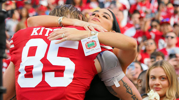 San Francisco 49ers tight end George Kittle (85) hugs his wife Claire Kittle before the NFC Championship football game against the Detroit Lions at Levi's Stadium.