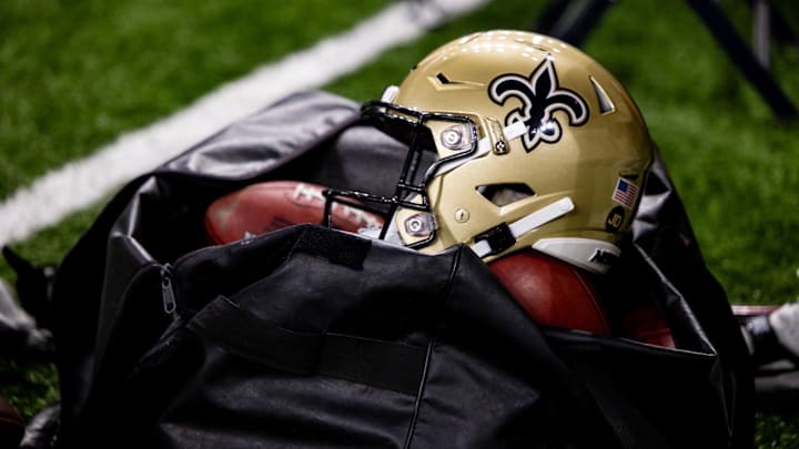 Nov 5, 2023; New Orleans, Louisiana, USA;  Detailed view of the New Orleans Saints helmet and ball bag against the Chicago Bears during the first half at the Caesars Superdome. Mandatory Credit: Stephen Lew-Imagn Images