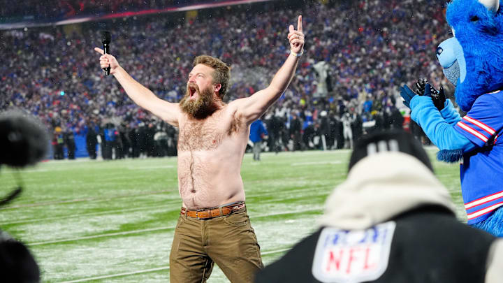 Jan 19, 2025; Orchard Park, New York, USA; Former Buffalo Bills quarterback Ryan Fitzpatrick rallies the crowd before the game against the Baltimore Ravens in a 2025 AFC divisional round game at Highmark Stadium
