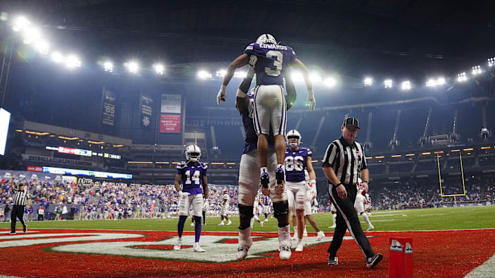 Kansas State running back Dylan Edwards (3) celebrates the go-ahead touchdown against Rutgers during the second half of the Rate Bowl at Chase Field on Dec. 26, 2024, in Phoenix. Kansas State running back Dylan Edwards (3) celebrates the go-ahead touchdown against Rutgers during the second half of the Rate Bowl at Chase Field on Dec. 26, 2024, in Phoenix.