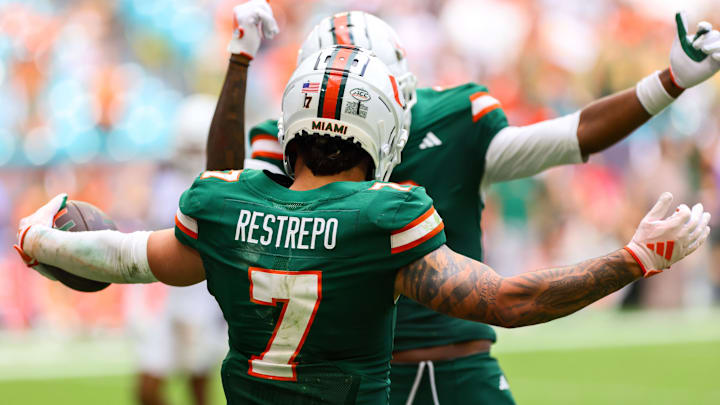 Nov 2, 2024; Miami Gardens, Florida, USA; Miami Hurricanes wide receiver Xavier Restrepo (7) celebrates after scoring a touchdown against the Duke Blue Devils during the fourth quarter at Hard Rock Stadium. Mandatory Credit: Sam Navarro-Imagn Images