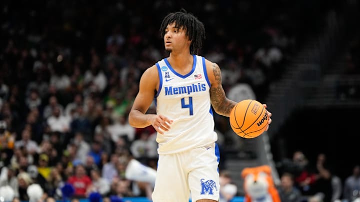 Mar 21, 2025; Seattle, WA, USA; Memphis Tigers guard PJ Haggerty (4) looks for an open player during the first half against Colorado State Rams at Climate Pledge Arena. Mandatory Credit: Stephen Brashear-Imagn Images