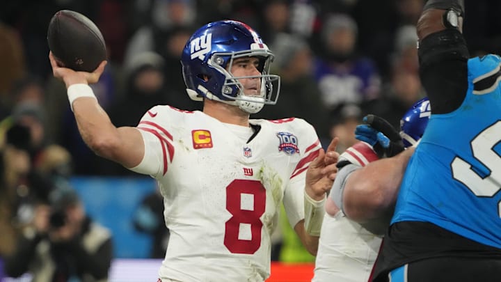 Nov 10, 2024; Munich, Germany; New York Giants quarterback Daniel Jones (8) throws the ball against the Carolina Panthers  in the second half during the 2024 NFL Munich Game at Allianz Arena. Mandatory Credit: Kirby Lee-Imagn Images