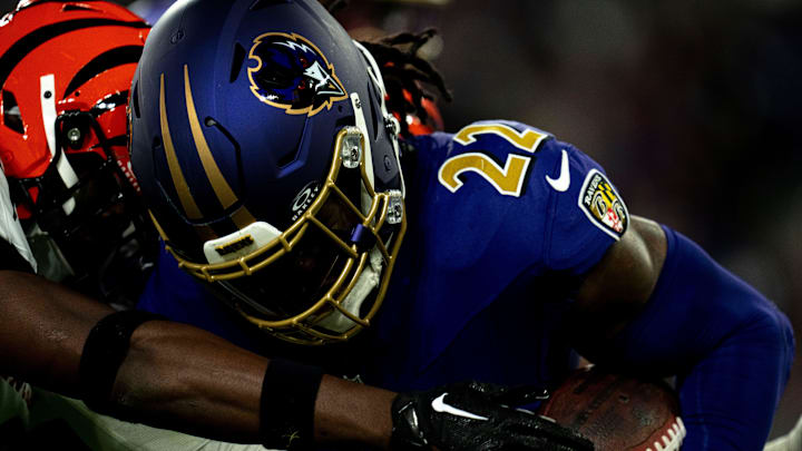 Cincinnati Bengals safety Jordan Battle (27) tackles Baltimore Ravens running back Derrick Henry (22) in the second quarter of the NFL game at M&T Banks Stadium in Baltimore on Thursday, Nov. 7, 2024.