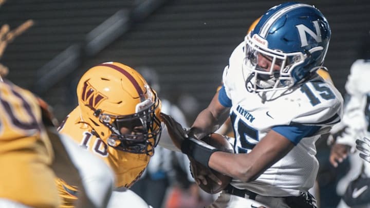Warwick High School LB Tracy Pope Jr. makes a critical tackle against Norview.