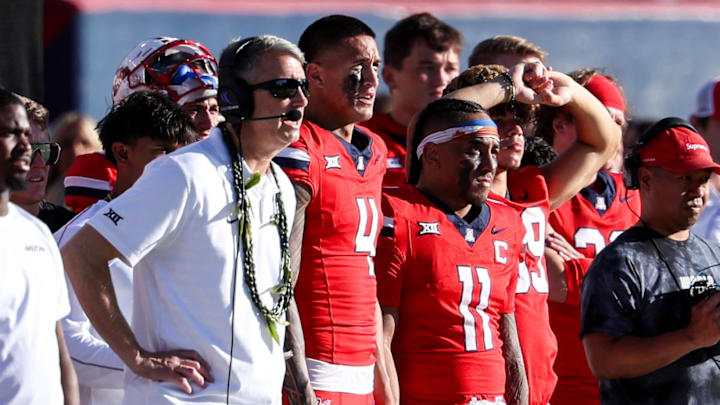 Oct 19, 2024; Tucson, Arizona, USA; Arizona Wildcats head coach Brent Brennan, wide receiver Tetairoa McMillan (4), and quarterback Noah Fifita (11) look on during the fourth quarter against the Colorado Buffaloes at Arizona Stadium