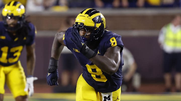 Aug 31, 2024; Ann Arbor, Michigan, USA;  Michigan Wolverines defensive end Derrick Moore (8) pursues a play against the Fresno State Bulldogs at Michigan Stadium. Mandatory Credit: Rick Osentoski-Imagn Images