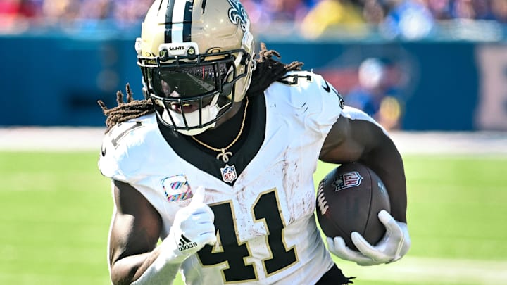 Sep 28, 2025; Orchard Park, New York, USA; New Orleans Saints running back Alvin Kamara (41) carries the ball against the Buffalo Bills in the third quarter at Highmark Stadium. Sep 28, 2025; Orchard Park, New York, USA; New Orleans Saints running back Alvin Kamara (41) carries the ball against the Buffalo Bills in the third quarter at Highmark Stadium.