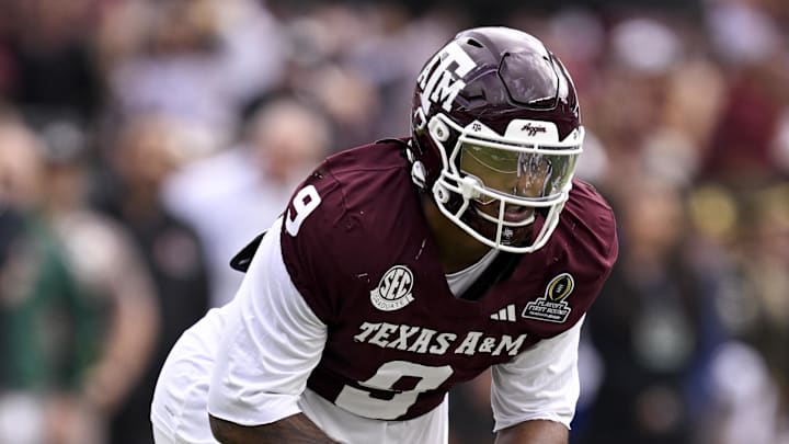 Dec 20, 2025; College Station, TX, USA; Texas A&M Aggies defensive end Cashius Howell (9) lines up during the game between the Aggies and the Hurricanes at Kyle Field. Mandatory Credit: Jerome Miron-Imagn Images