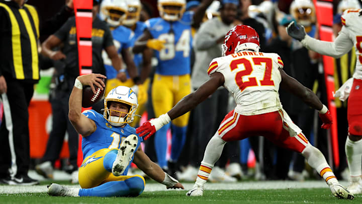 Chargers quarterback Justin Herbert (10) picks up a first down against Chiefs