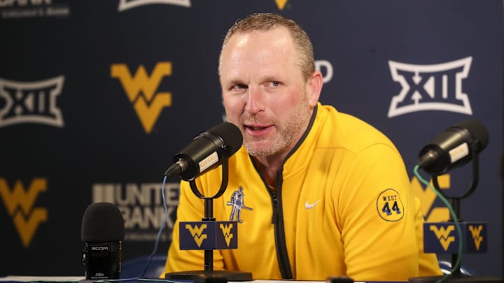 Feb 19, 2025; Morgantown, West Virginia, USA; West Virginia Mountaineers head coach Darian DeVries answers questions from the media after defeating the Cincinnati Bearcats at WVU Coliseum. Mandatory Credit: Ben Queen-Imagn Images