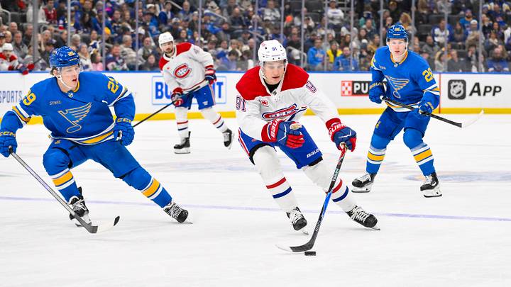Jan 3, 2026; St. Louis, Missouri, USA; Montreal Canadiens center Oliver Kapanen (91) controls the puck as St. Louis Blues right wing Jonatan Berggren (29) defends during the third period at Enterprise Center. Mandatory Credit: Jeff Curry-Imagn Images