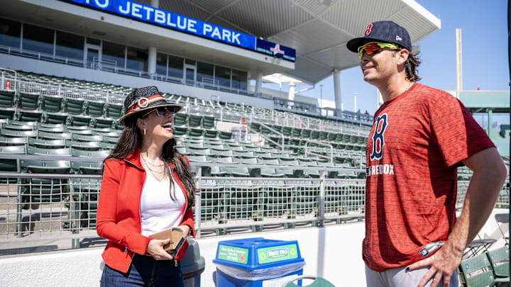 Lee County, FL, USA;  Boston Red Sox co-owner Linda Pizzuti Henry, talks with first baseman Triston Casas (36) during spring training at Jet Blue Park at Fenway South.
