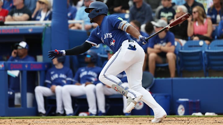 Feb 22, 2025: Toronto Blue Jays second base Orelvis Martinez (13) hits a home run during the fourth inning against the New York Yankees at TD Ballpark. 