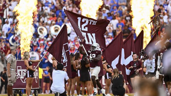 Texas A&M Aggies defensive end Nana Boadi-Owusu runs out with the 12th Man flag before the game against the Florida Gators at Kyle Field. Texas A&M Aggies defensive end Nana Boadi-Owusu runs out with the 12th Man flag before the game against the Florida Gators at Kyle Field.