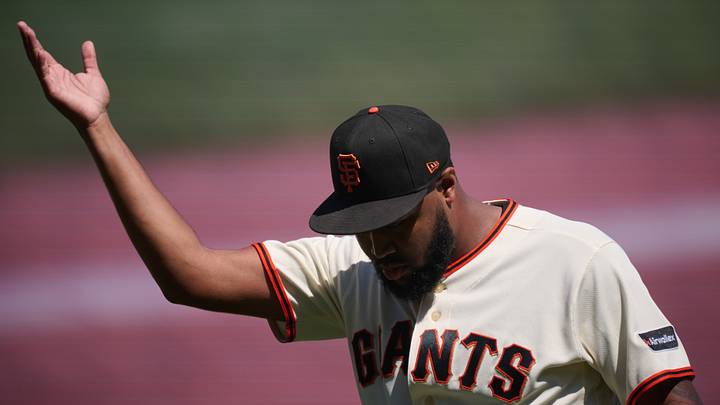 San Francisco, California, USA; San Francisco Giants pitcher Dylan Smith (66) acknowledges the crowd after striking out the side against the Detroit Tigers in the ninth inning at Oracle Park. Mandatory Credit: Robert Edwards-Imagn Images