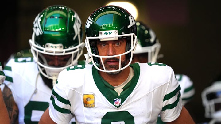 Nov 10, 2024; Glendale, Arizona, USA; New York Jets quarterback Aaron Rodgers (8) warms up before the game against the Arizona Cardinals at State Farm Stadium. Mandatory Credit: Joe Camporeale-Imagn Images