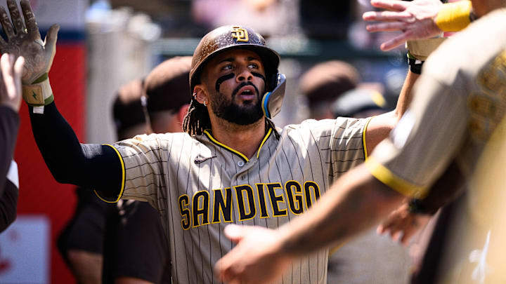 Apr 19, 2026; Anaheim, California, USA; San Diego Padres second baseman Fernando Tatis Jr. (23) is greeted by teammates after scoring during the fourth inning against the Los Angeles Angels at Angel Stadium. Mandatory Credit: William Liang-Imagn Images
