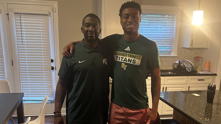 TJ "Truth" Umenyiora with Michigan State Spartans coach Blue Adams