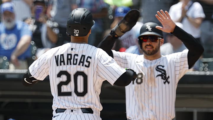 Chicago White Sox third baseman Miguel Vargas (20) celebrated with Mike Tauchman (18) after hitting a two-run home run against the Kansas City Royals at Rate Field. 