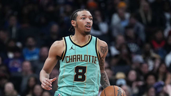Apr 9, 2025; Toronto, Ontario, CAN; Charlotte Hornets guard Nick Smith Jr. (8) dribbles the ball up court against the Toronto Raptors during the fourth quarter at Scotiabank Arena. Mandatory Credit: Nick Turchiaro-Imagn Images