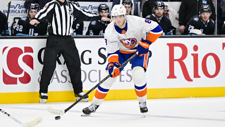 Jan 11, 2025; Salt Lake City, Utah, USA; New York Islanders defenseman Noah Dobson (8) passes the puck against the Utah Hockey Club during first period at the Delta Center. Mandatory Credit: Christopher Creveling-Imagn Images