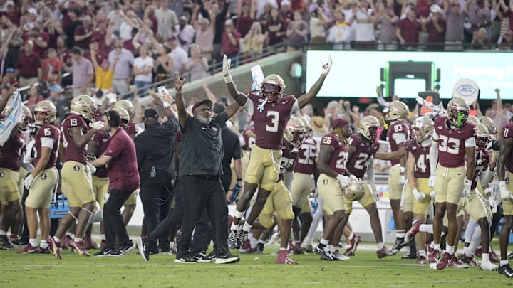 Aug 30, 2025; Tallahassee, Florida, USA; Florida State Seminoles running back Kam Davis (3) and associate head coach Odell Haggins react after a play Alabama Crimson Tide during the second half at Doak S. Campbell Stadium. Mandatory Credit: Melina Myers-Imagn Images