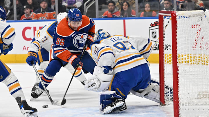Dec 9, 2025; Edmonton, Alberta, CAN; Edmonton Oilers right winger David Tomasek 86) shoots the puck against  Buffalo Sabres goalie Colten Ellis (92) during the first period at Rogers Place. Mandatory Credit: Walter Tychnowicz-Imagn Images