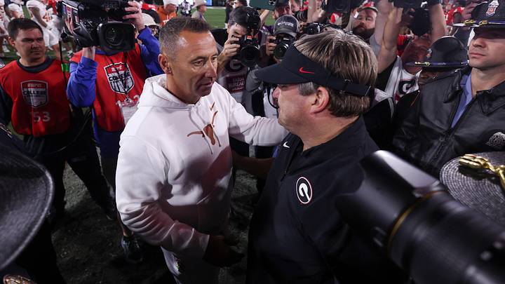 Nov 15, 2025; Athens, Georgia, USA; Texas Longhorns head coach Steve Sarkisian and Georgia Bulldogs head coach Kirby Smart interact after a game at Sanford Stadium. Mandatory Credit: Brett Davis-Imagn Images