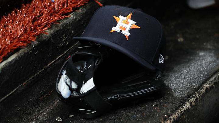 A detailed view of a Houston Astros baseball hat and glove lay in the dugout. Credit: Kim Klement-USA TODAY Sports A detailed view of a Houston Astros baseball hat and glove lay in the dugout. Credit: Kim Klement-USA TODAY Sports