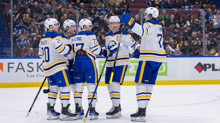 Jan 21, 2025; Vancouver, British Columbia, CAN; Buffalo Sabres defenseman Bowen Byram (4) and forward Jiri Kulich (20) and forward JJ Peterka (77) and defenseman Rasmus Dahlin (26) and forward Tage Thompson (72) celebrate Peterka’s goal against the Vancouver Canucks in the third period at Rogers Arena. Mandatory Credit: Bob Frid-Imagn Images