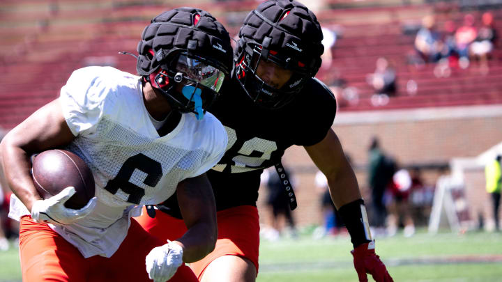 Cincinnati Bearcats running back Evan Pryor (6) runs with the ball as Cincinnati Bearcats linebacker Jonathan Thompson (22) forces him out of bounds during the University of Cincinnati annual Red and Black Spring football game and practice at Nippert Stadium in Cincinnati on Saturday, April 13, 2024.
