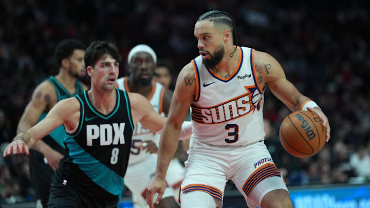Nov 18, 2025; Portland, Oregon, USA; Phoenix Suns forward Dillon Brooks (3) handles the ball against Portland Trail Blazers forward Deni Avdija (8) during the second half at Moda Center. Mandatory Credit: Soobum Im-Imagn Images