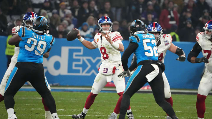 Nov 10, 2024; Munich, Germany; New York Giants quarterback Daniel Jones (8) throws the ball against the Carolina Panthers in the second half during the 2024 NFL Munich Game at Allianz Arena. Mandatory Credit: Kirby Lee-Imagn Images