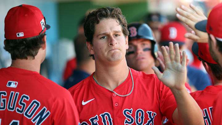 Feb 28, 2025; Clearwater, Florida, USA; Boston Red Sox outfielder Roman Anthony (48) is congratulated after he scored a run against the Philadelphia Phillies  during the third inning  at BayCare Ballpark. Mandatory Credit: Kim Klement Neitzel-Imagn Images