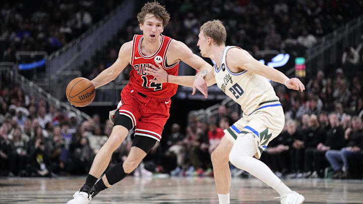 Feb 3, 2026; Milwaukee, Wisconsin, USA; Chicago Bulls forward Matas Buzelis (14) drives to the basket against Milwaukee Bucks guard AJ Green (20) in the first half at Fiserv Forum. Mandatory Credit: Michael McLoone-Imagn Images