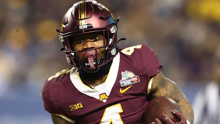Dec 28, 2021; Phoenix, AZ, USA; Minnesota Golden Gophers running back Mar'Keise Irving (4) against the West Virginia Mountaineers in the Guaranteed Rate Bowl at Chase Field. Mandatory Credit: Mark J. Rebilas-Imagn Images