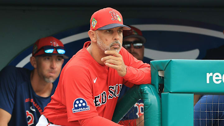 Feb 22, 2026; Fort Myers, Florida, USA; Boston Red Sox manager Alex Cora (13) looks on from the dugout during the third inning against the Toronto Blue Jays  at JetBlue Park at Fenway South. Mandatory Credit: Kim Klement Neitzel-Imagn Images
