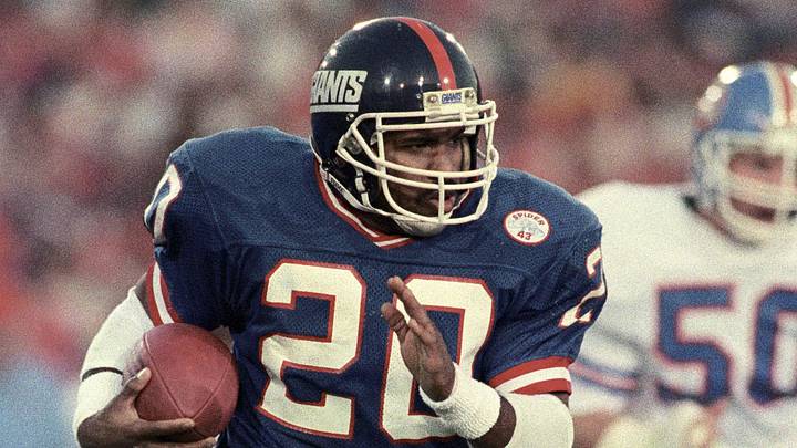 Jan 25, 1987; Pasadena, CA, USA; FILE PHOTO; New York Giants running back Joe Morris (20) carries the ball against the Denver Broncos during Super Bowl XXI at the Rose Bowl. The Giants defeated the Broncos 39-20. M Jan 25, 1987; Pasadena, CA, USA; FILE PHOTO; New York Giants running back Joe Morris (20) carries the ball against the Denver Broncos during Super Bowl XXI at the Rose Bowl. The Giants defeated the Broncos 39-20. M