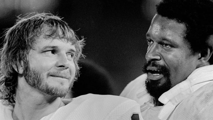 Aug 23, 1975; Atlanta, GA, USA; FILE PHOTO; Oakland Raiders quarterback Ken Stabler (12) and Gene Upshaw (63) on the sideline against the Atlanta Falcons at Fulton County Stadium during a pre-season game. Mandatory Credit: Manny Rubio-USA TODAY Sports