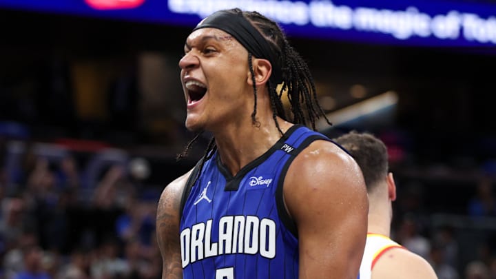 Apr 15, 2025; Orlando, Florida, USA;  Orlando Magic forward Paolo Banchero (5) reacts after a play against the Atlanta Hawks in the fourth quarter at Kia Center. Mandatory Credit: Nathan Ray Seebeck-Imagn Images