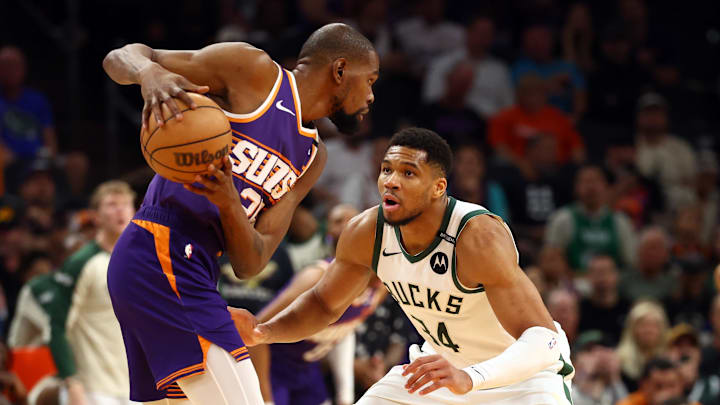 Mar 24, 2025; Phoenix, Arizona, USA; Milwaukee Bucks forward Giannis Antetokounmpo (34) defends against Phoenix Suns forward Kevin Durant (35) at Footprint Center. Mandatory Credit: Mark J. Rebilas-Imagn Images