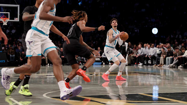 Nov 19, 2024; Brooklyn, New York, USA; Charlotte Hornets guard LaMelo Ball (1) looks to shoot the ball against Brooklyn Nets forward Noah Clowney (21) during the first quarter at Barclays Center. Mandatory Credit: Brad Penner-Imagn Images