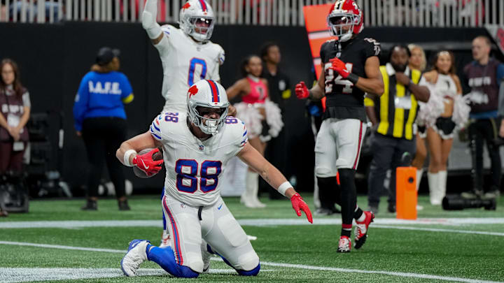 Oct 13, 2025; Atlanta, Georgia, USA; Buffalo Bills tight end Dawson Knox (88) reacts after catching a touchdown against the Atlanta Falcons during the first half of a game at Mercedes-Benz Stadium.