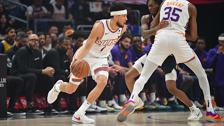 Apr 10, 2024; Los Angeles, California, USA; Phoenix Suns guard Devin Booker (1) moves the ball as Apr 10, 2024; Los Angeles, California, USA; Phoenix Suns guard Devin Booker (1) moves the ball as