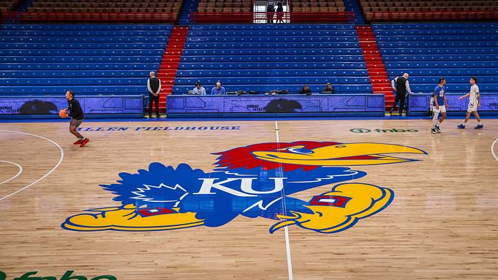 Mar 1, 2025; Lawrence, Kansas, USA; Kansas Jayhawks logo at center court prior to the game against the Texas Tech Red Raiders at Allen Fieldhouse. Mandatory Credit: William Purnell-Imagn Images Mar 1, 2025; Lawrence, Kansas, USA; Kansas Jayhawks logo at center court prior to the game against the Texas Tech Red Raiders at Allen Fieldhouse. Mandatory Credit: William Purnell-Imagn Images
