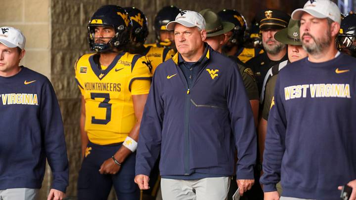 Sep 26, 2026; Morgantown, West Virginia, USA; West Virginia Mountaineers head coach Rich Rodriguez leads his team onto the field prior to their game against the Oklahoma State Cowboys at Milan Puskar Stadium. Mandatory Credit: Ben Queen-Imagn Images Sep 26, 2026; Morgantown, West Virginia, USA; West Virginia Mountaineers head coach Rich Rodriguez leads his team onto the field prior to their game against the Oklahoma State Cowboys at Milan Puskar Stadium. Mandatory Credit: Ben Queen-Imagn Images